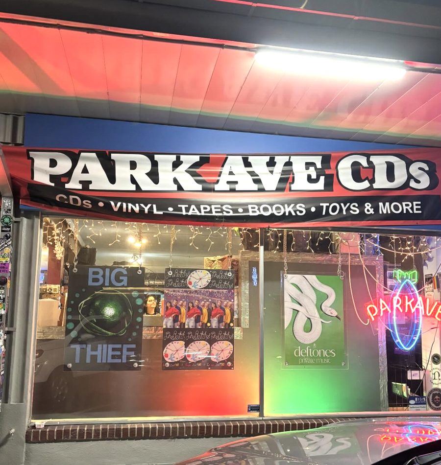 Park Ave CDs storefront lit up at night